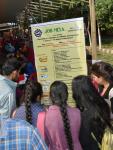 Candidates looking up at the List of Employers details during Jobmela